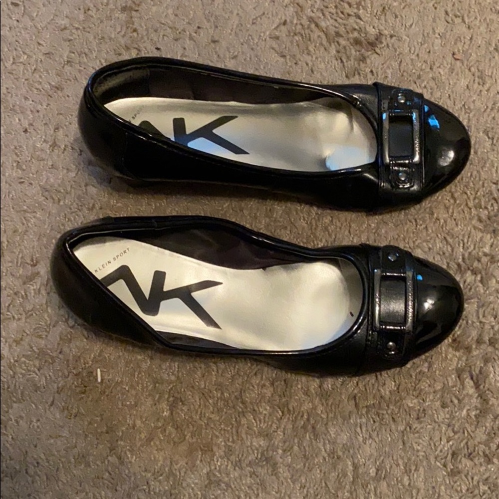 A black pair of women’s flats.